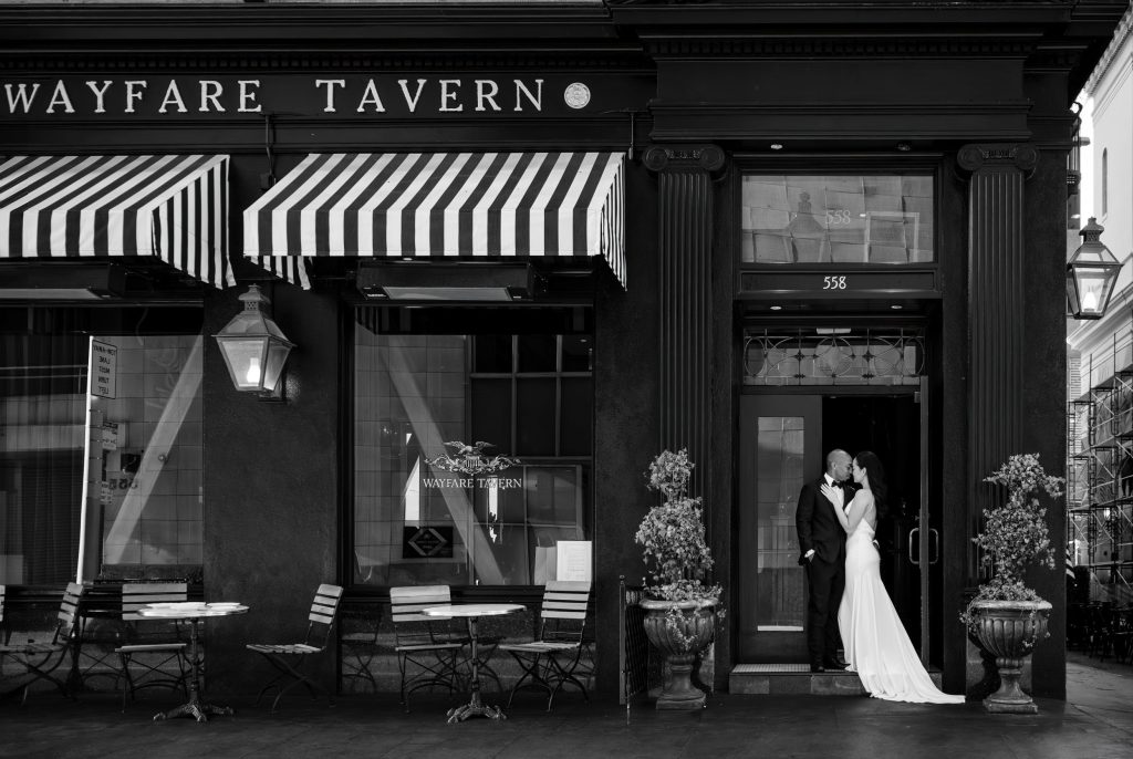 Bride and groom in front of Wayfare Tavern