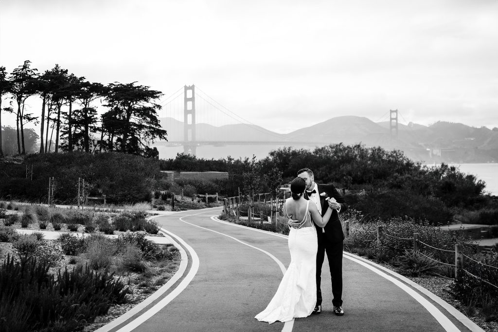 bride and groom in front of the Golden Gate Bridge in San Francisco